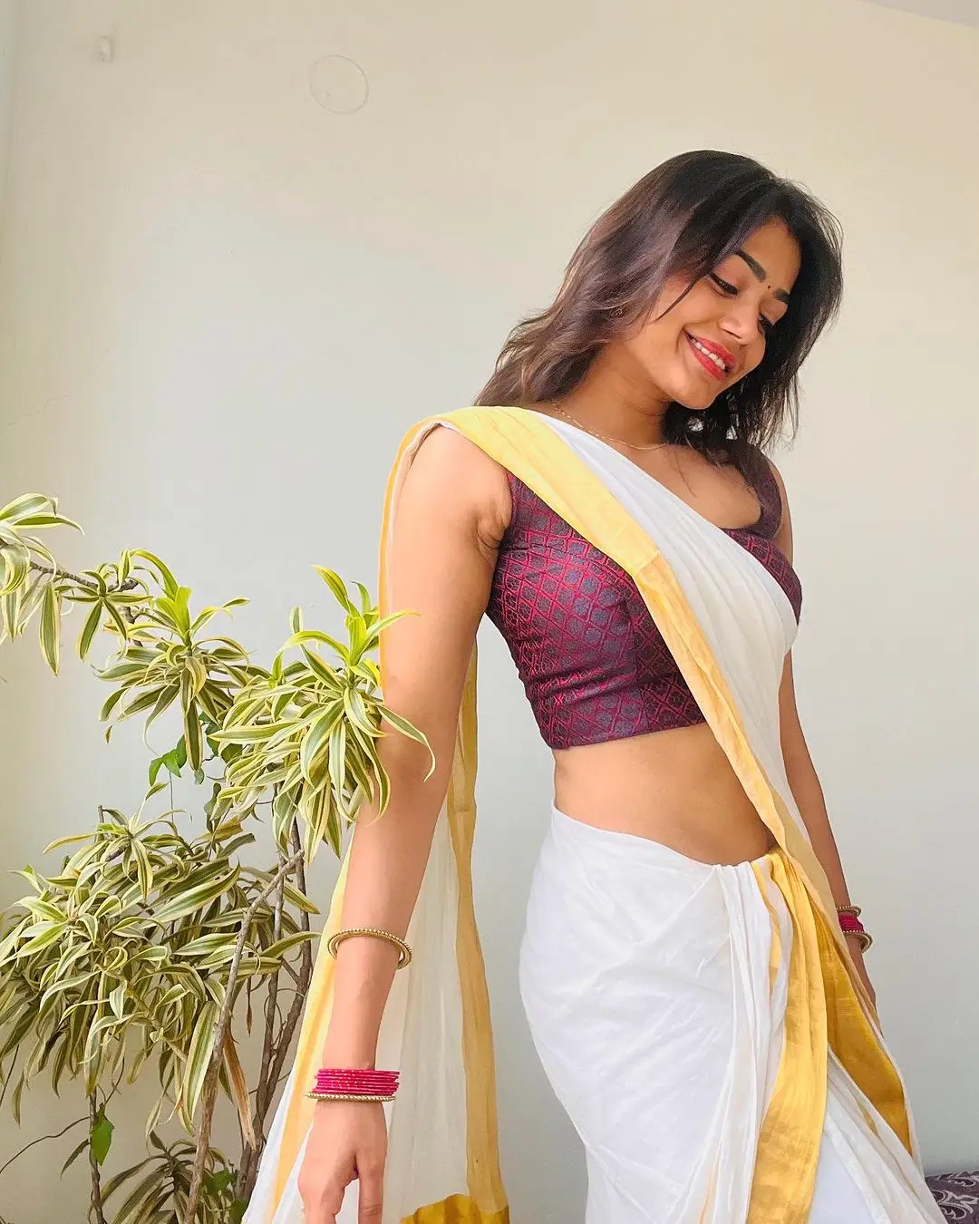 Actress Payal Radhakrishna in White Saree Sleeveless Maroon Blouse